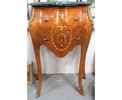 Louis XVI style French bombe small commode, the serpentine shaped green marble top over two frieze drawers with boxwood scrol