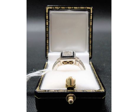 Modern 18ct white gold diamond set Art Deco style cocktail ring, the square bezel set with four small diamonds and edged with