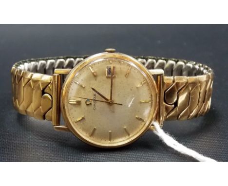 AMENDMENT 9CT GOLD Omega gentlemen's manual wind wristwatch, the champagne dial with date aperture.