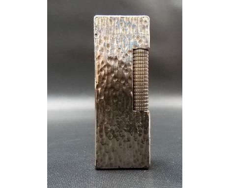 Dunhill silver plated Rollagas lighter with textured decoration.