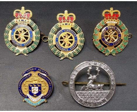 Three enamel & gilt metal Ambulance Service badges; together with an Ambulance Brigade badge & one other enamel badge (5)