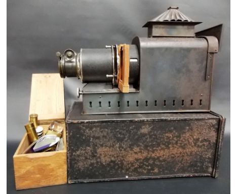 Early 20th Century magic lantern with blackened tin plate body & brass adjustable lens within a metal travel case; together w