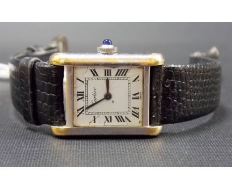 Ladies' Cartier manual wind tank wristwatch, the signed square enamel dial with Roman numerals, sapphire winding crown, the b