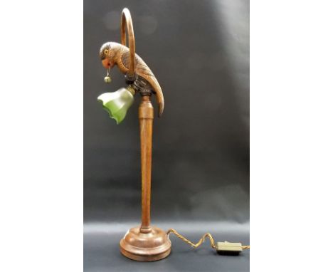  20th Century oak carved novelty table lamp base, carved as a parrot with glass inset eyes, a ring with a bell in its mouth, 