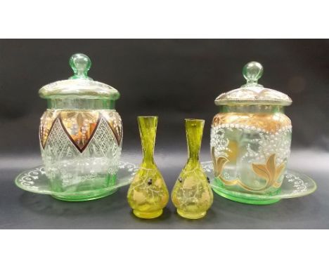 Pair of Victorian green tint gilded & enamel decorated glass lidded jars on stands; together with a pair of small yellow tint