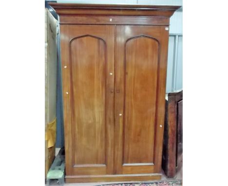 Victorian mahogany gentleman's compactum wardrobe, the ogee moulded cornice over a pair of arched cupboard doors enclosing tw