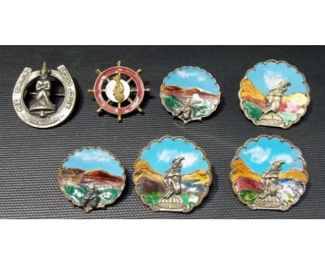 Five enamel Cornish piskie badges; together with two others