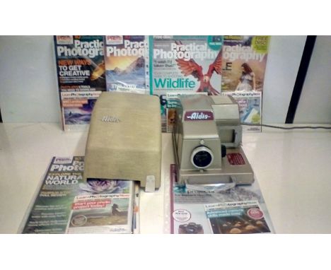 Vintage Aldis Slide Projector together with Photograph Magazines and CD's