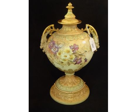 A Royal Rudolstadt, Germany, twin handled pedestal vase and cover, decorated in the blush ivory manner of Royal Worcester, wi