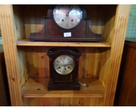 A mid-20th century domed top mantel clock, the silver dial bearing the makers name James Walker, London, together with a maho