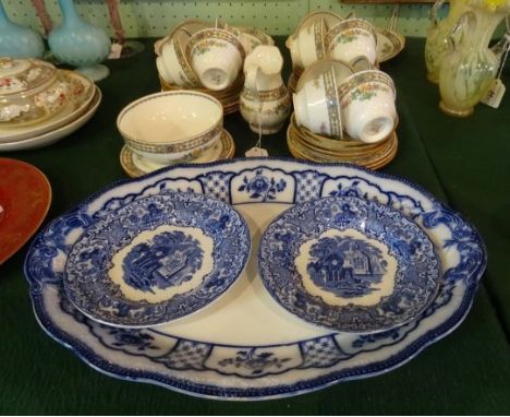 A Mintons Luxor pattern part-tea service, an eight place setting comprising: cups, saucers, side plates, sugar bowl, cream ju