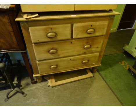An early 20th century pine dressing chest, having swivel mirror over two short and two long drawers.