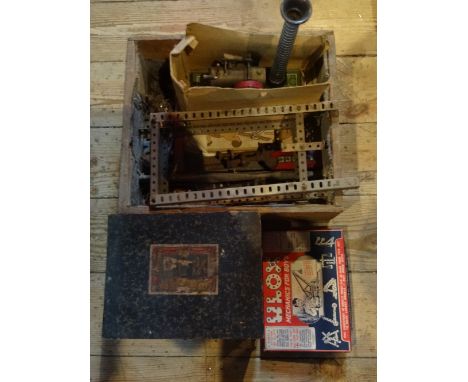 A quantity of vintage meccano to include: a paraffin powered steam engine, together with a Continental child's magic lantern 