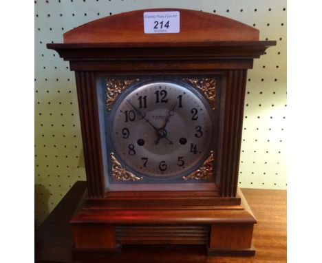 An early 20th century mahogany cased bracket clock, the silvered and brass dial bearing Arabic numerals and the makers name F