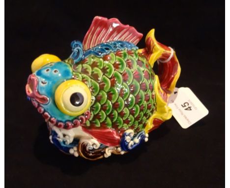 A 20th century Taiwan-Cochin ceramic teapot, designed as a fish with bulbous eyes, having majolica-style glaze, impressed sea