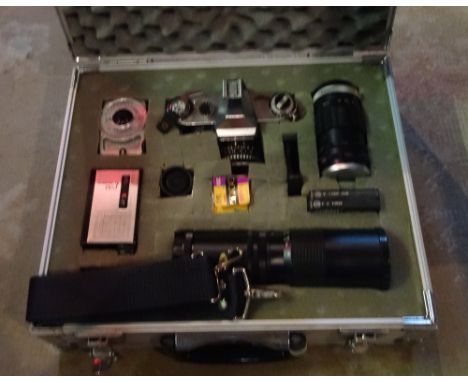A Praktica Nova 1B camera, with assorted accessories, in fitted steel case.