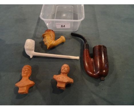 A carved pipe bowl, depicting Field Marshall Foch, marked Belgique 1918, together with a Boer War Pretoria 1901 carved pipe a
