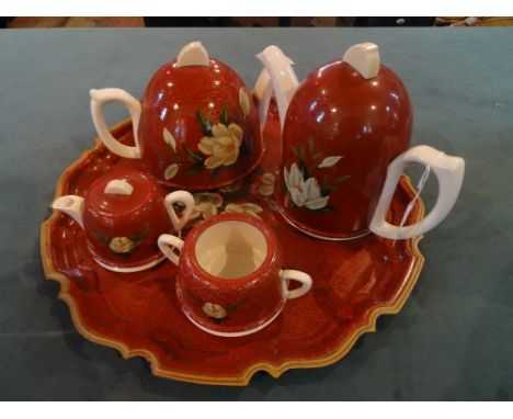 A mid-20th century ceramic tea set on confirming tray, comprising: teapot, coffee pot, cream jug and twin handled sugar bowl,