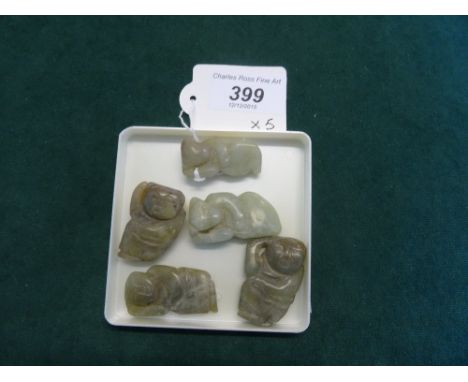 A collection of five carved green jade figures.