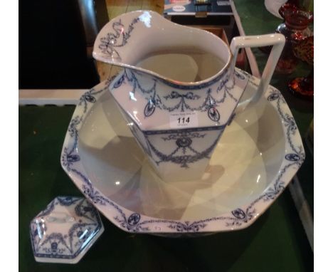 An early 20th century blue and white wash jug and bowl with matching dressing table jar, printed marks reading Ruskin, Adderl