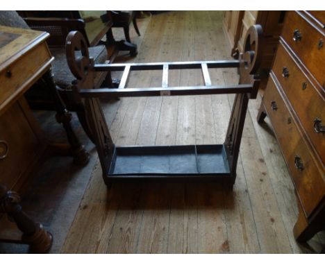 An early 20th century oak stick stand, formed in the Arts & Crafts manner, 71cm wide. Condition Report: Generally good with a