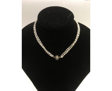 A three row pearl necklace with silver clasp. - NO RESERVE