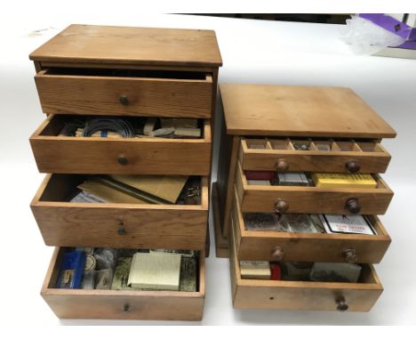 Two small cabinets of watchmakers tools and spare watch parts. 