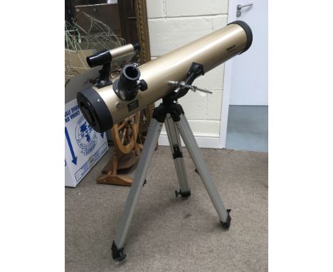 A Tasco Luminova telescope on tripod. NO RESERVE.