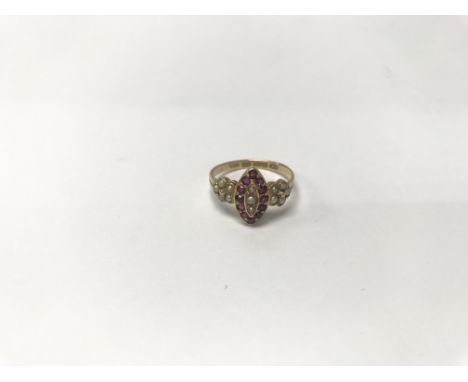 An Early 20th century 15carat gold ring set with rubies and seed pearl with clear defined hallmarks. NO RESERVE.