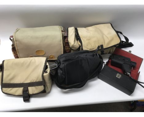 Five good quality camera bags with a cased 'Halina' 8mm cine camera.