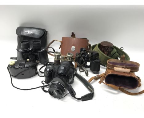 A collection of binoculars including Minolta and a Fuji digital SLR camera. NO RESERVE.