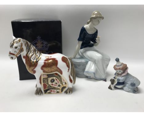 A Royal Crown Derby figure of a Welsh Cob together with a seated Nao figure and a Lladro clown. NO RESERVE.