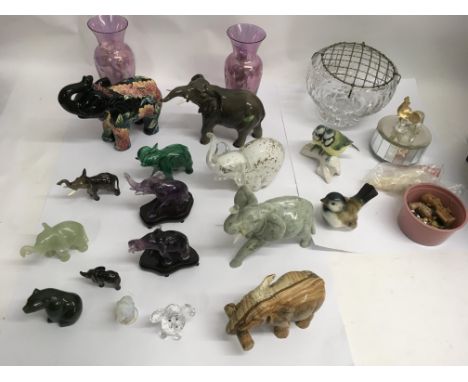 A collection of stone, glass and ceramic elephants, Goebel birds and other items