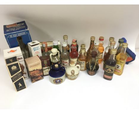 A large collection of vintage alcohol miniatures to include Chamboed, Jaegermeister, Two Fingers tequila, Johnnie Walker whis