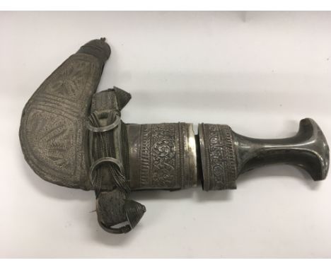 An ornate Arabic ceremonial dagger with sheath. NO RESERVE.