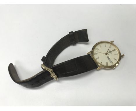 A 9ct Gold Gents Rotary watch, the dial with date aperture strap broken. NO RESERVE.