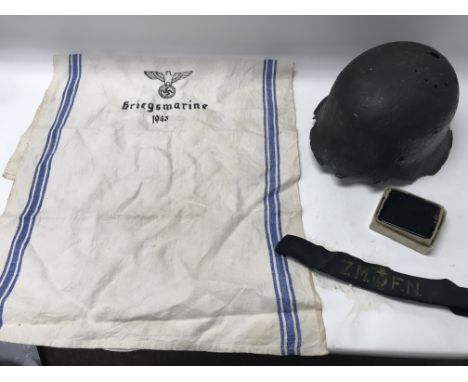 A damaged WW2 German infantry helmet, a ZM. F. N headband, military compass and third reich tea towel. NO RESERVE.