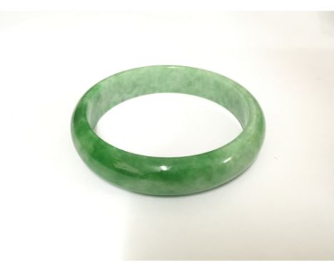A spinach green jade bracelet, total weight approx 60 grams. NO RESERVE.