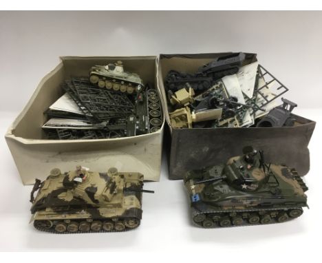 A collection of model tanks, vehicles and soldiers, various makes including Tamiya, Bandai and others. NO RESERVE.