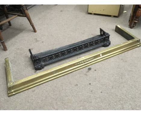 A cast iron fire guard and a brass fender, approx 131cm (2).