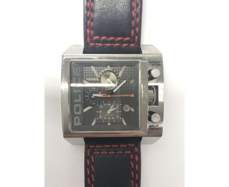 A unusual gents Police wristwatch. The large textured square dislmpresents three subsidiary dials and date aperture. Mounted 