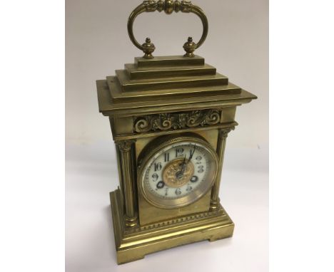 A brass cased eight day mantle clock with an enamel dial, approx 19cm. NO RESERVE.