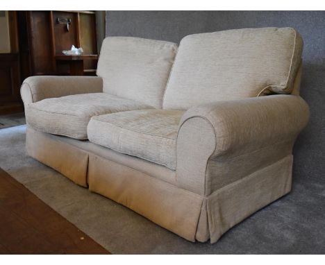 A three seater Laura Ashley sofa, upholstered in beige fabric. H.96 x 180 x 92cm 