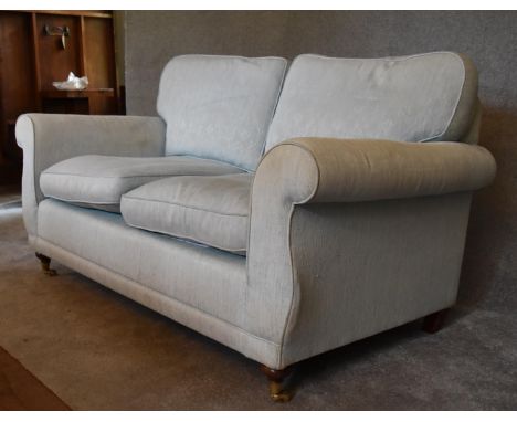 A two seater Laura Ashley sofa, upholstered in duck egg blue fabric. H.77 x 160 x 80cm 