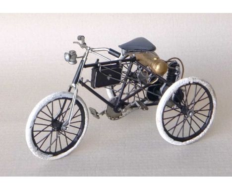 A group of eight scale model steel black tricycles, 16x14x26cm. (8)