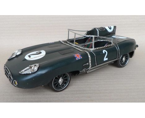 A group of twelve scale model dark green racing cars, 9x13x32cm. (12)