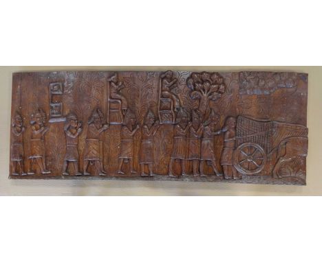 A decorative carved wooden panel, 75x200x6cm.