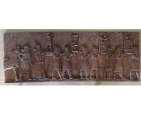 A decorative carved wooden panel,75x200x6cm.
