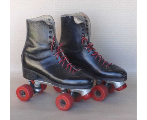 Pair of red roller skates, 10x12x26cm, a pair of  black roller skates, 32x13x31cm and a pair of roller skates, 25x10x29cm. (3