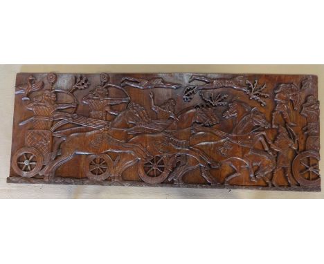 A decorative carved wooden panel, 75x198x6cm.